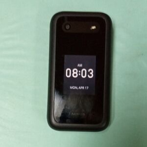 Nokia Black Compact Flip Phone with External Clock Display